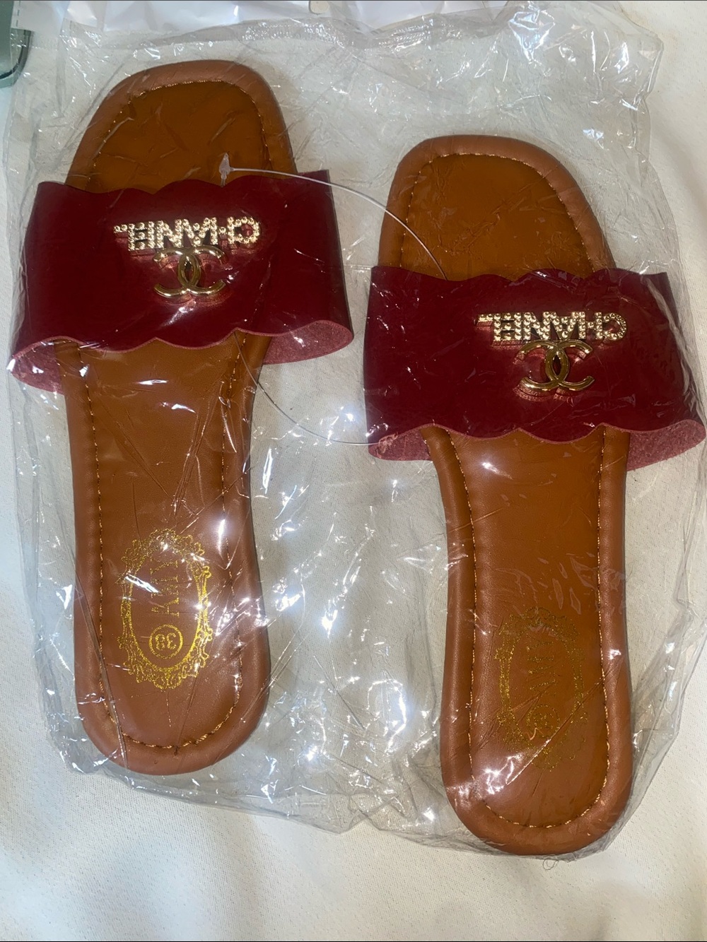 Women's Burgundy Slip-On Sandals with Gold Emblem
